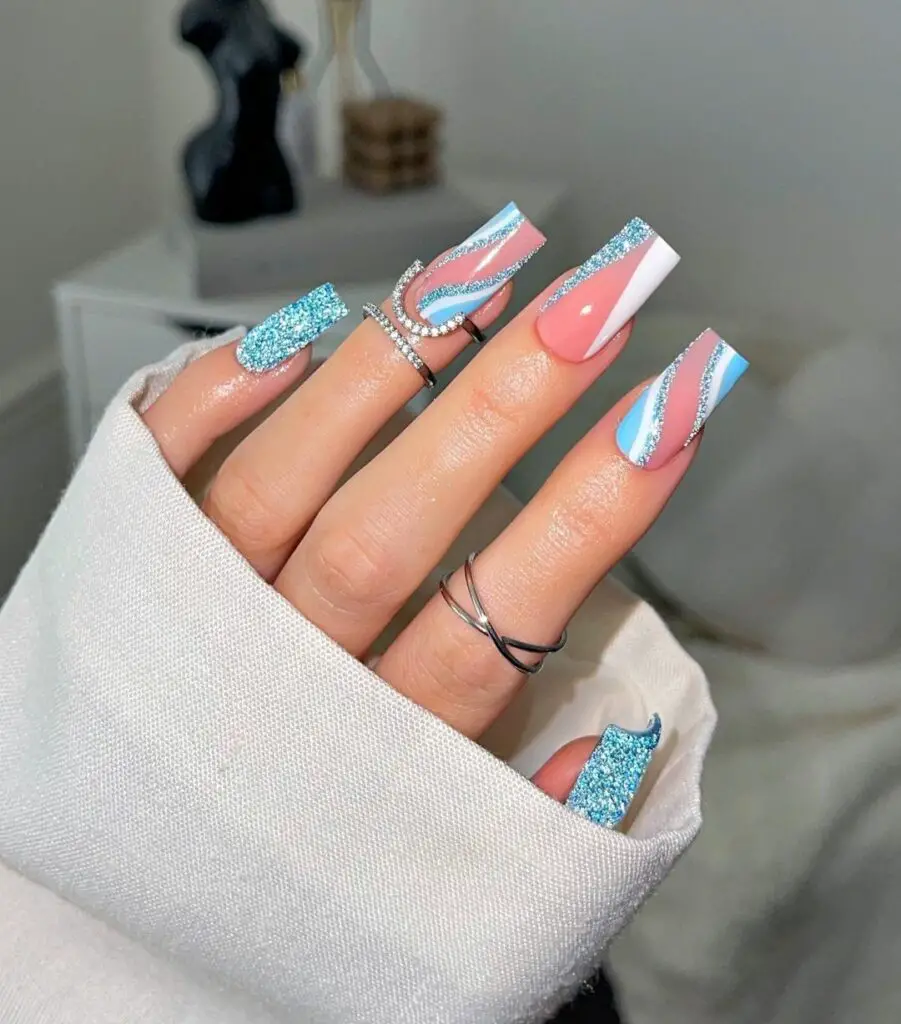 White and glittery blue nail design for graduation nail ideas