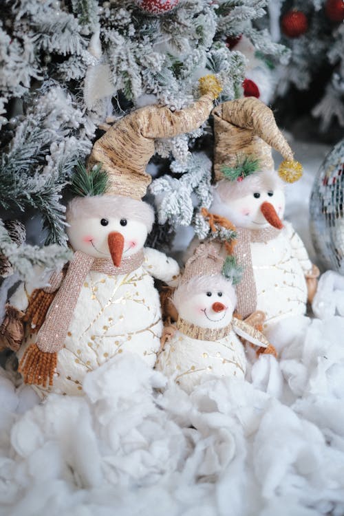 Free Snowmen by a Christmas Tree Stock Photo