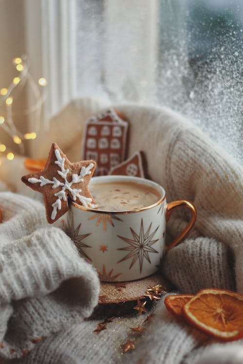 Free Cup of Hot Chocolate and Christmas Cookies on a Window Sill Stock Photo